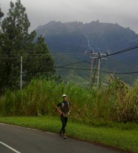 Finishing the first 50 km at 5:30 pm, Mt. Kinabalu is just becoming visible after the rain.